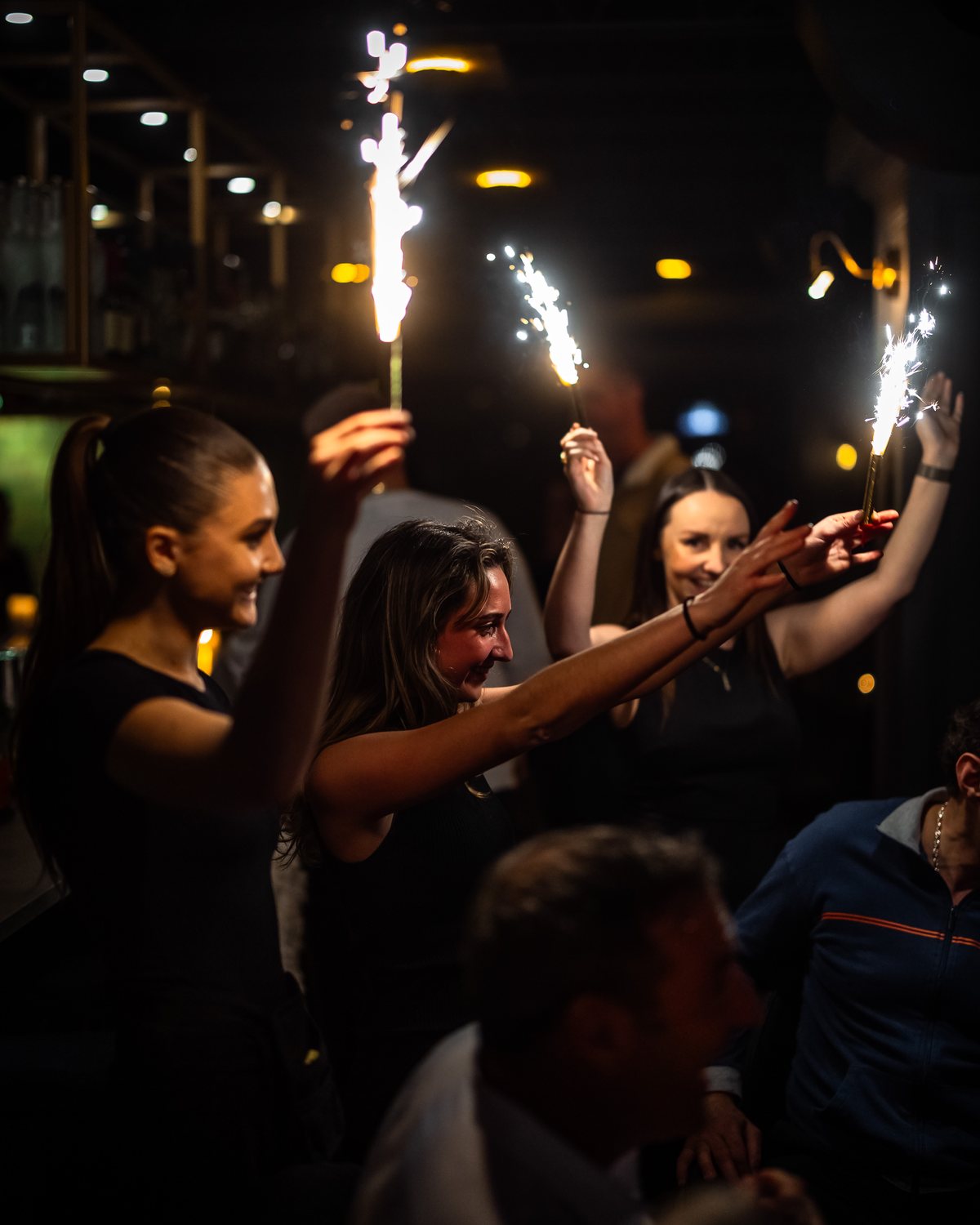 Guests celebrating with sparklers at Beacon Social House